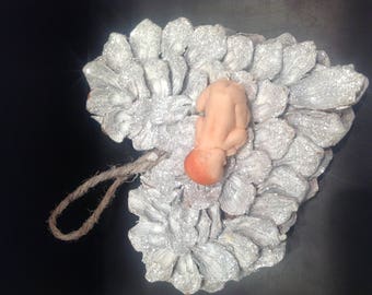 polymer clay on a silver heart baby