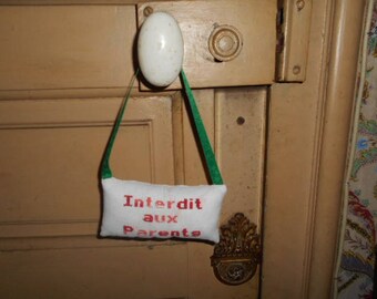 hand embroidered door pillow - forbidden parents