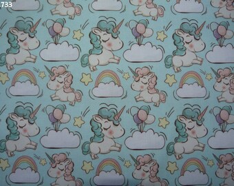 Fabric C733 unicorns in the clouds on a pale green background coupon 35x50cm