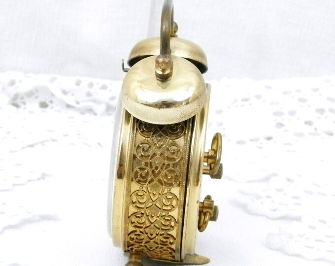 Small Working Vintage West German 1960s Metal Mechanical Wind Up Alarm Clock with Roman Numerals and Filigree Decoration, Mid Century Small Working Vintage West German 1960s Metal Mechanical Wind Up Alarm Clock with Roman Numerals and Filigree Decoration, Mid Century