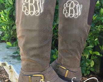 monogram plaque long leather boots