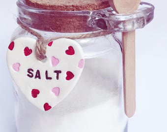 Glass storage jar with clay tag