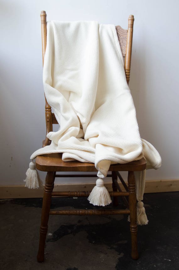 White blanket with tassels