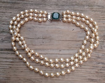 Vintage three strand glass Pearl necklace with green rhinestone clasp