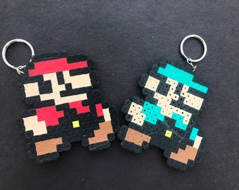 Mario and Luigi keychains and Princess Peach magnet
