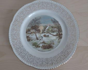 vintage Homer Laughlin dinnerware in the "Currier and Ives" print, gold trim