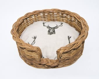 Traditional Wicker dog Basket with classic,Scottish deer stag pattern cushion.