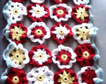 Daisy doily crocheted in multicolor wool