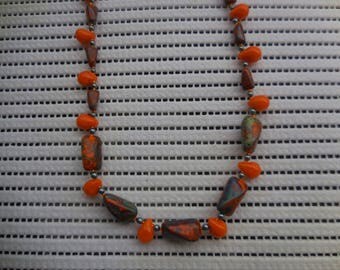 orange and green women necklace