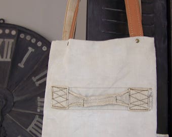 Purse made with a military bag, leather handles