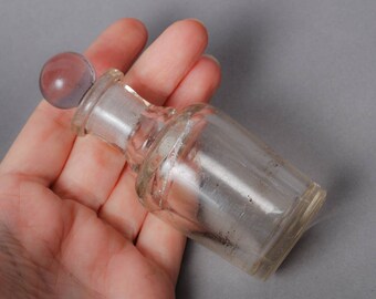 Antique small blue glass bottle with stoper, medical or laboratory bottle.