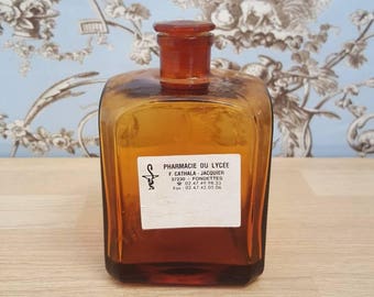 Bottle of pharmacy in orange glass, amber, old pharmacy bottle , medicine
