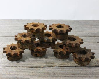 Rusty old sprockets, iron gears, 2 inches in diameter. Priced individually