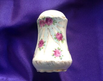 Vintage hand painted porcelain sugar shaker.