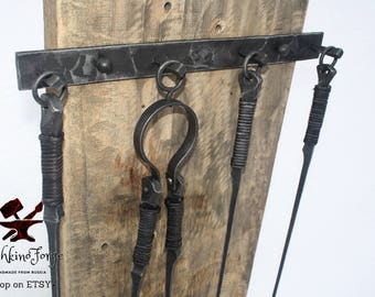 Hand forged fireplace tools rustic style wrought iron and Hand crafed fireplace set tools: -fireplace poker -fireplace tongs -fireplace shovel -hanger Original forged design. A traditional combination of metal and leather. Burning