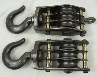 big old pulley hoist Old iron pulley industrial iron suspension