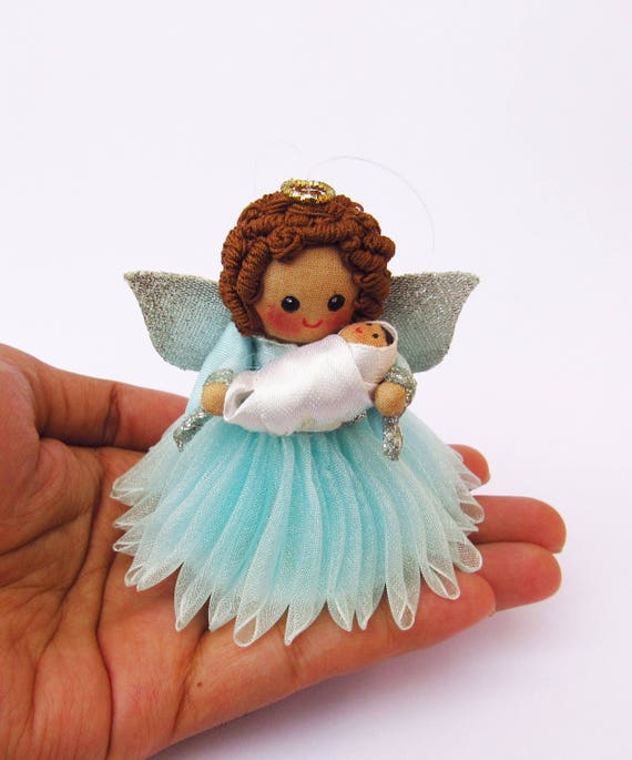 Miniature angel ornament Guardian angel holding baby Baby