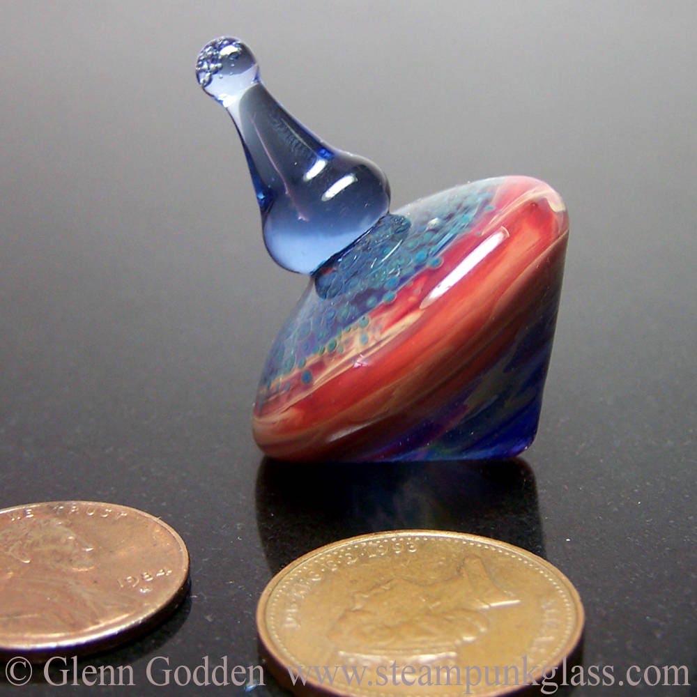 Blue and red glass desktop spinning top executive toy