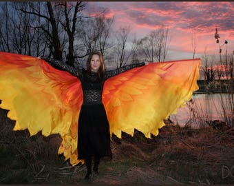 Phoenix wings. Hand painted silk bird wings, feathers in colors of red, orange and yellow.