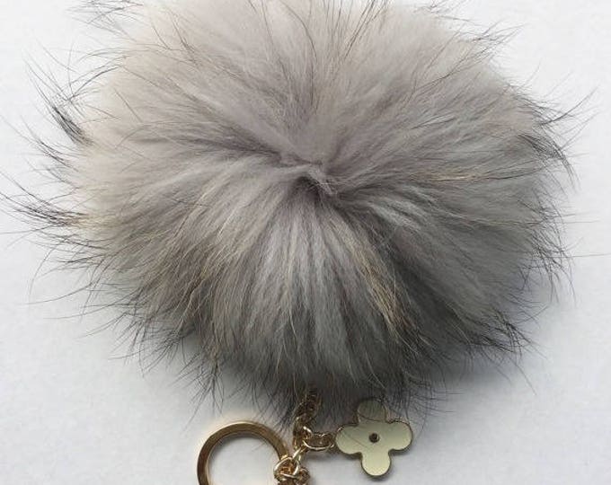 Light Gray with natural markings Raccoon Fur Pom Pom luxury bag pendant + black flower clover charm keychain
