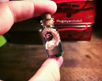 Jar with Octopus tentacle pendant necklace