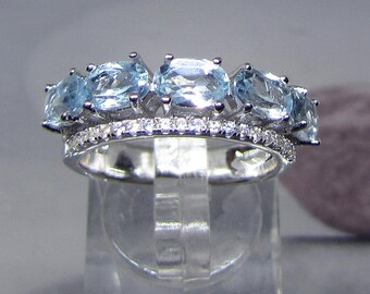 Zirconium ring and Blue Topaz stones on silver size 54