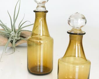 Pair of vintage amber glass bottles
