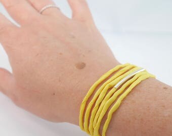 Silver tube and lemon yellow silk bracelet