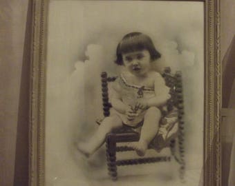 PHOTO SEPIA PHOTO OF A YOUNG CHILD IN ITS ORIGINAL FRAME REWORKED