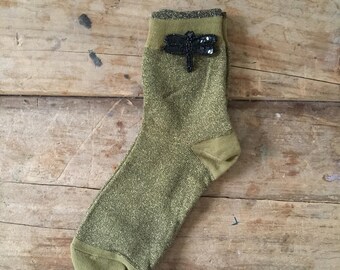 Tokyo socks in mustard and a dragonfly pin