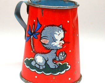 50s Tin Toy tea pitcher, Kitty graphics by Ohio Art.