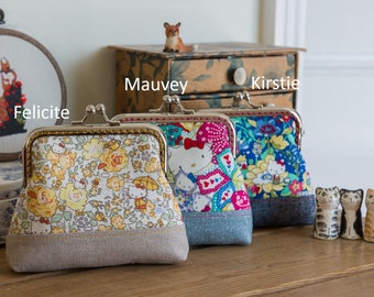 Frame purse made with Liberty Japan Hello Kitty print and metallic Essex Linen, with a hand stitched metal frame