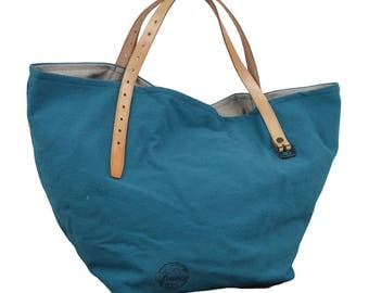 Blue purse with leather handles