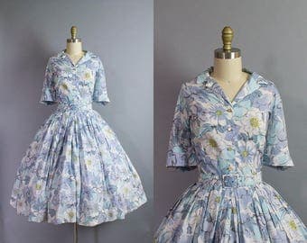 1950s Floral Shirtwaist Dress/ 50s blue crepe shirtdress with 3/4 sleeves/ Medium (40b/29w)