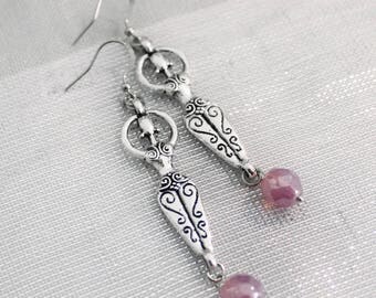 Earrings with pink pearls and fertility goddess charms