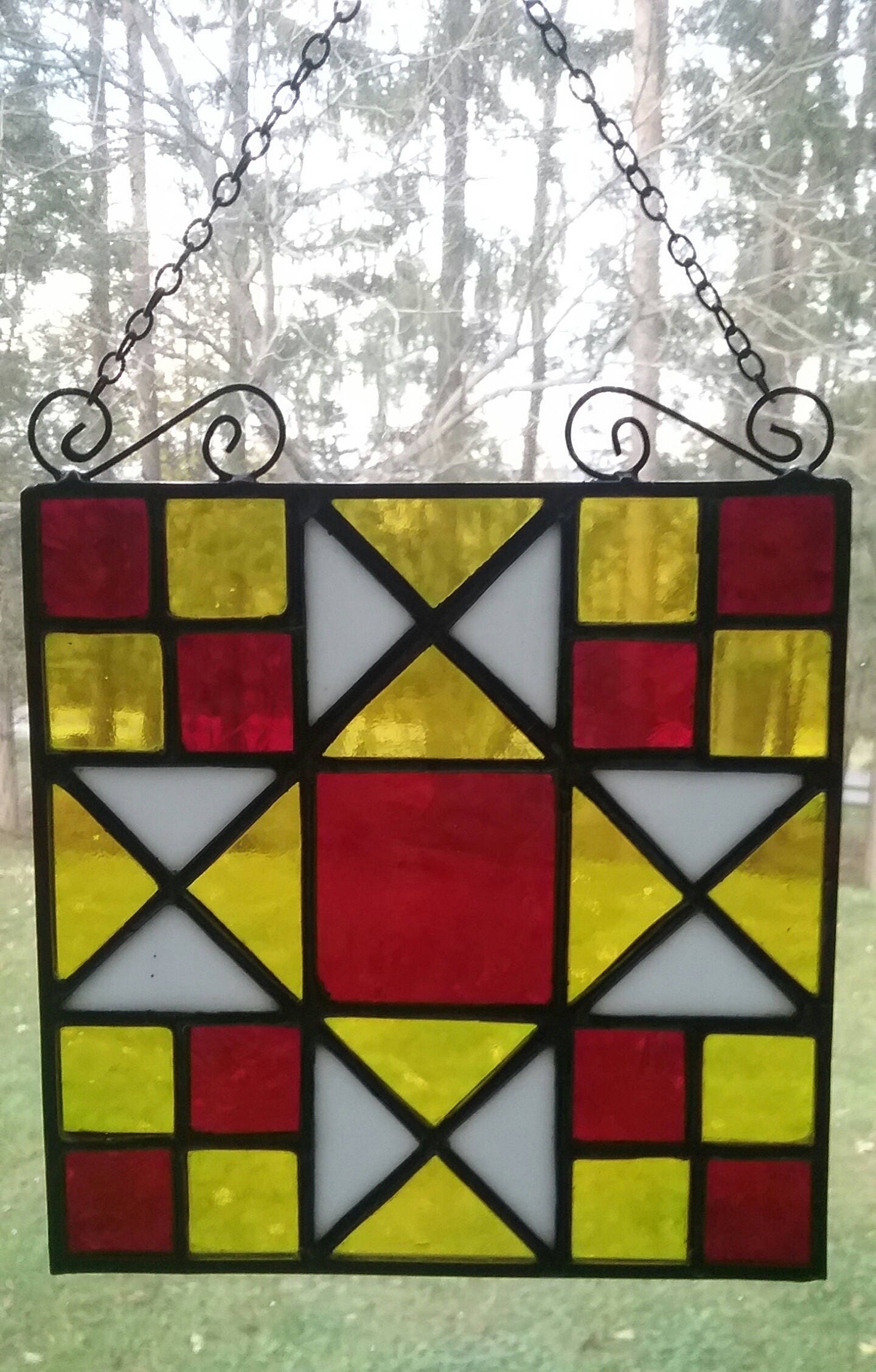 stained-glass-star-quilt-pattern-made-with-yellow-red-and