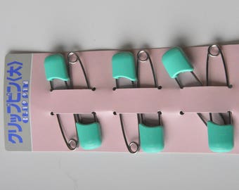 Safety pin in metal with safety Cap