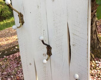 White rustic reclaimed wood coat rack with 3 antique vintage hooks