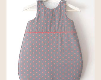 Gray sleeping bag with orange dots on order
