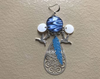 Blue earrings decorated with birds