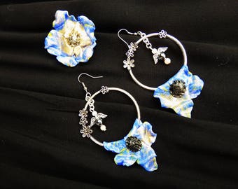 "Dramatic earrings * soft flowers"