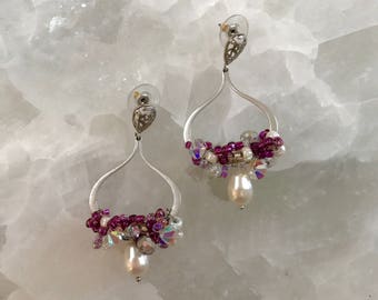 Matte silver hoop earring with paisley ear pad and sterling silver post with swarovski crystals and seed beads all wire wrapped together wit