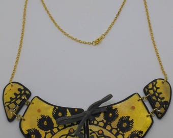 Black and gold polymer clay dreamcatcher bib