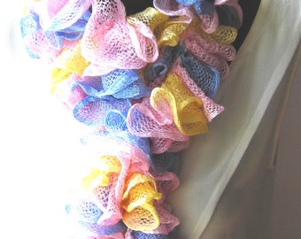 Hands in pastel shades made ruffle scarf it is about 140 cm.