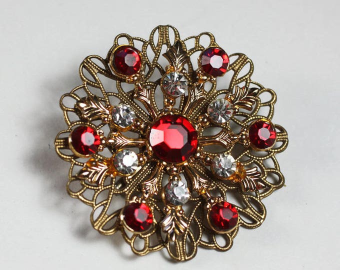 Red and Clear Rhinestone Filigree Brooch Gold Tone Atomic Style Vintage