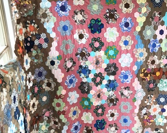 A lovely unused incomplete vintage hexagonal patchwork quilt