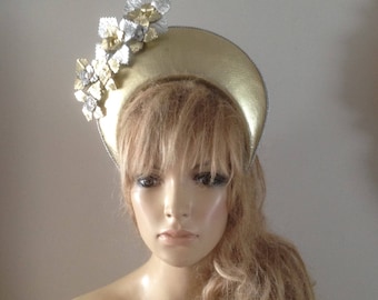 gold leather crown hat adorned with hand sculptured silver & gold leather flowers