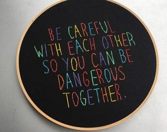 be dangerous - hand drawn and embroidered leftist adage hoop art wall hanging