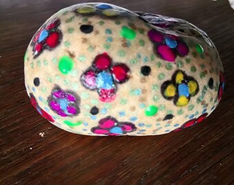 Pebble flowers on the painted nail