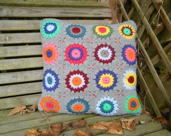 Crocheted granny square cushion cover